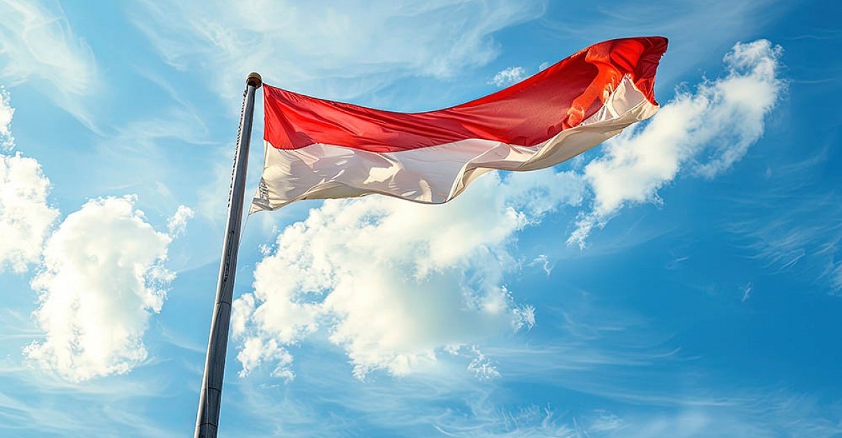 indonesian-flag-waving-flagpole-with-blue-sky-clouds-background-image_large